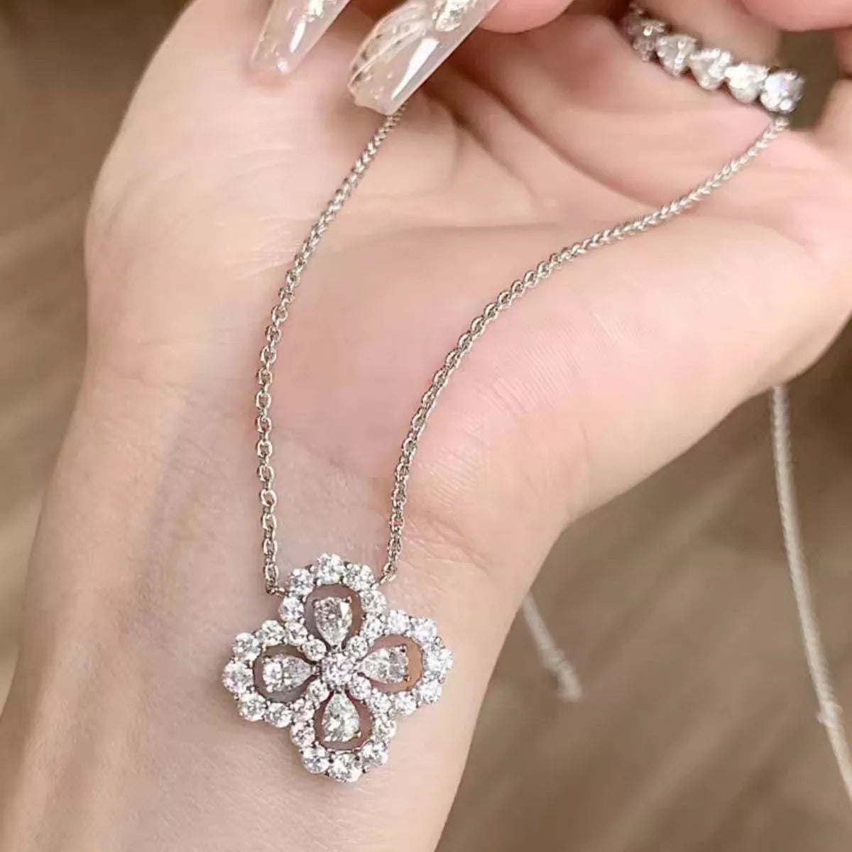 Clover pendant necklace worn layered
