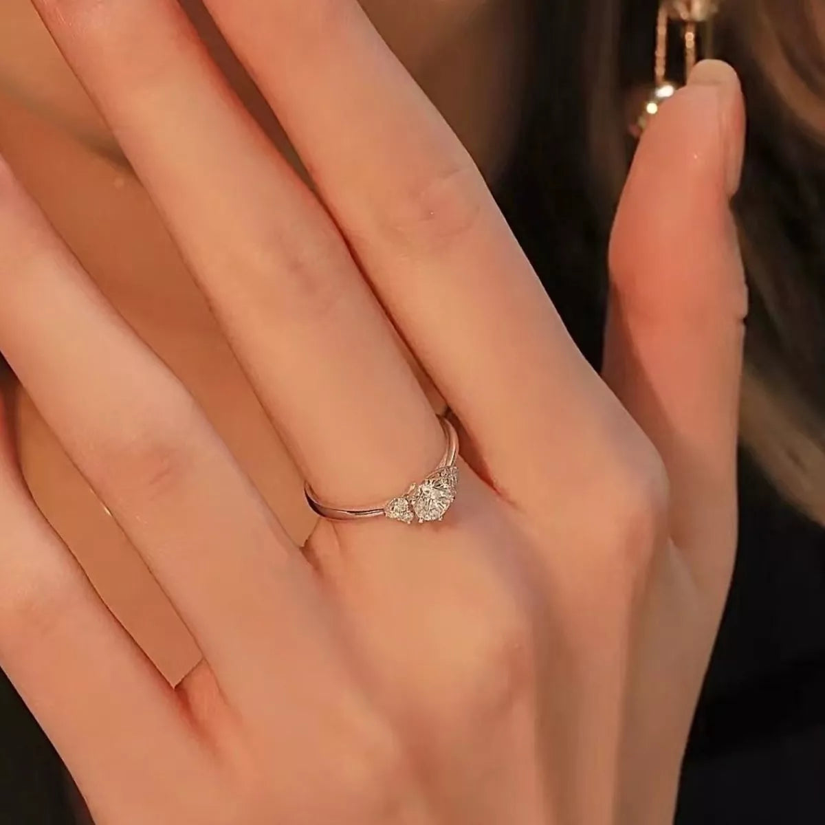 Sterling silver moissanite ring worn styled