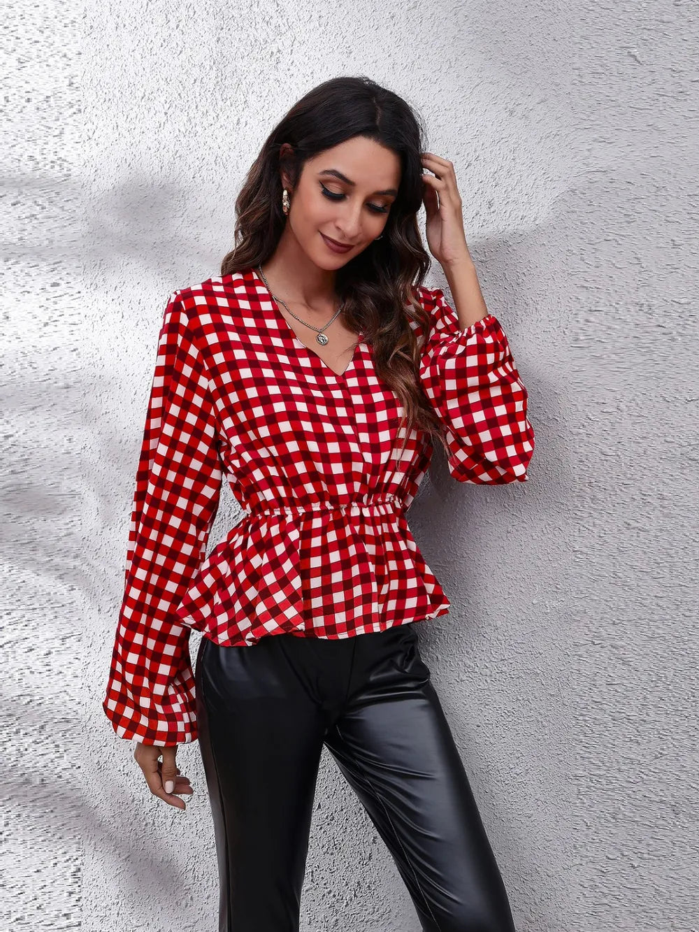 Plaid v neck peplum blouse on model deep red