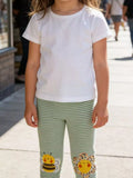 Girls striped bee flower leggings front view in matcha green