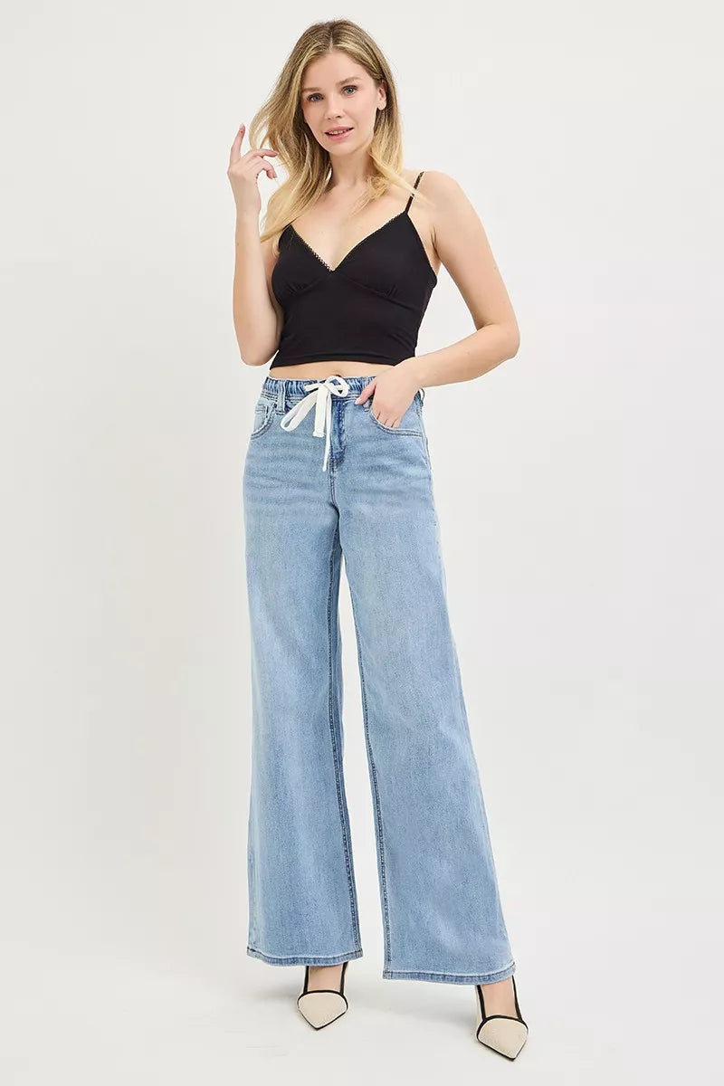 Model wearing RISEN slouchy drawstring jeans street style look