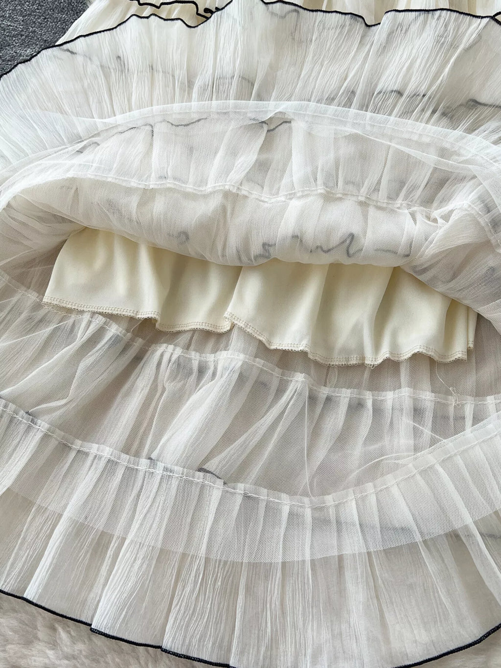 Full length view of ruffled contrast trim skirt