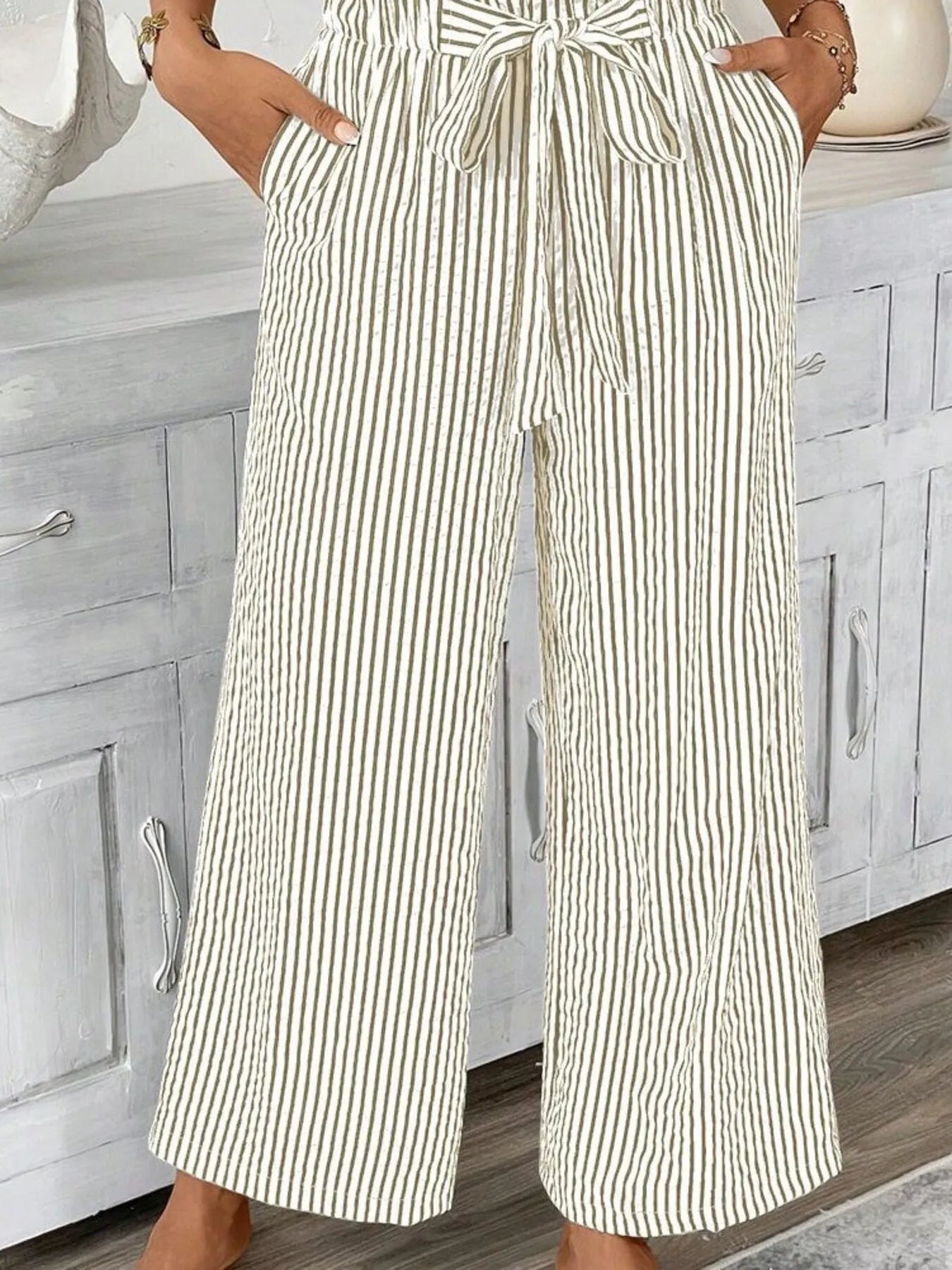 Khaki wide leg paper bag pants styled with heels