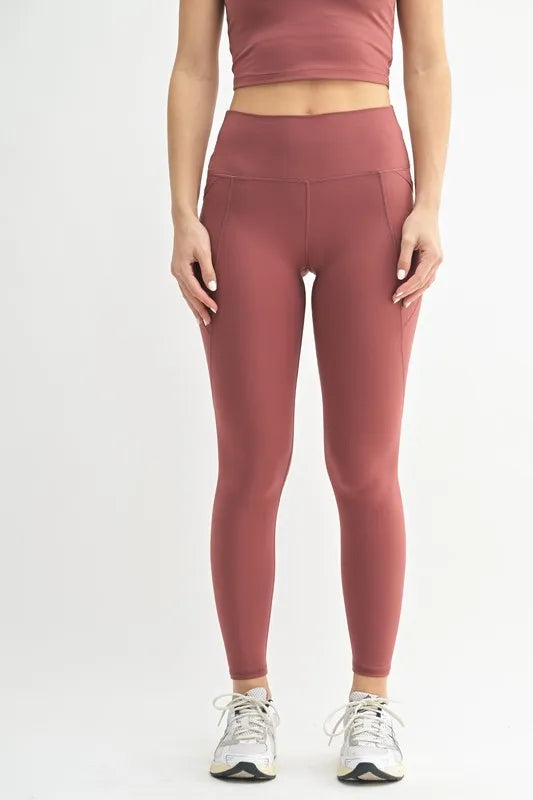 Red pear high waisted sculpt leggings front view on model