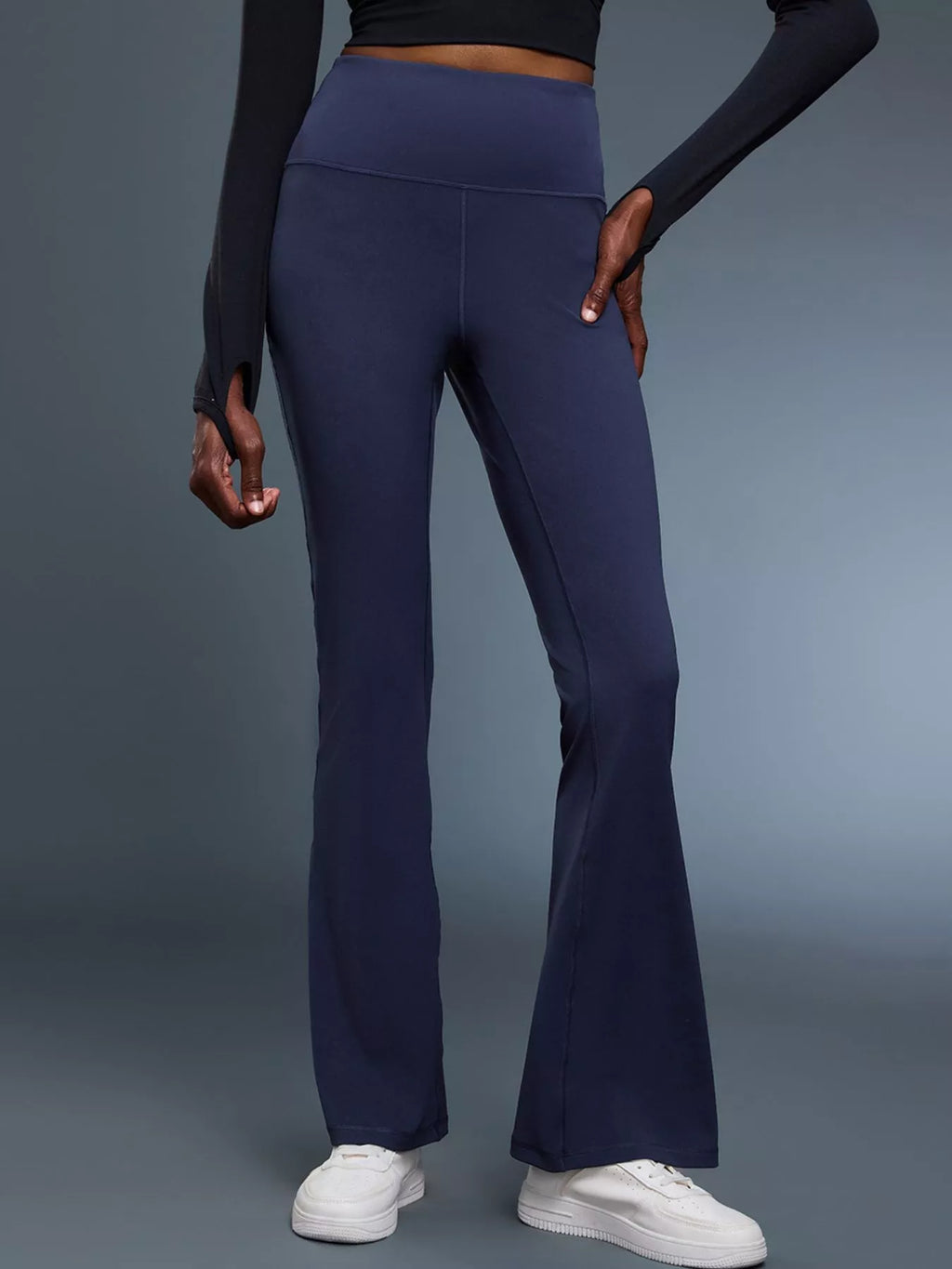 Flare active pants in burgundy on model