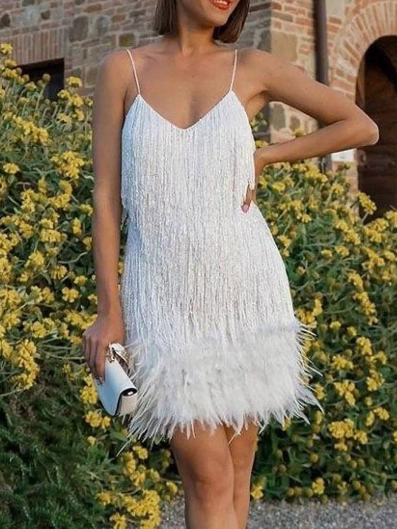 Feather fringe hem detail on sequin mini dress