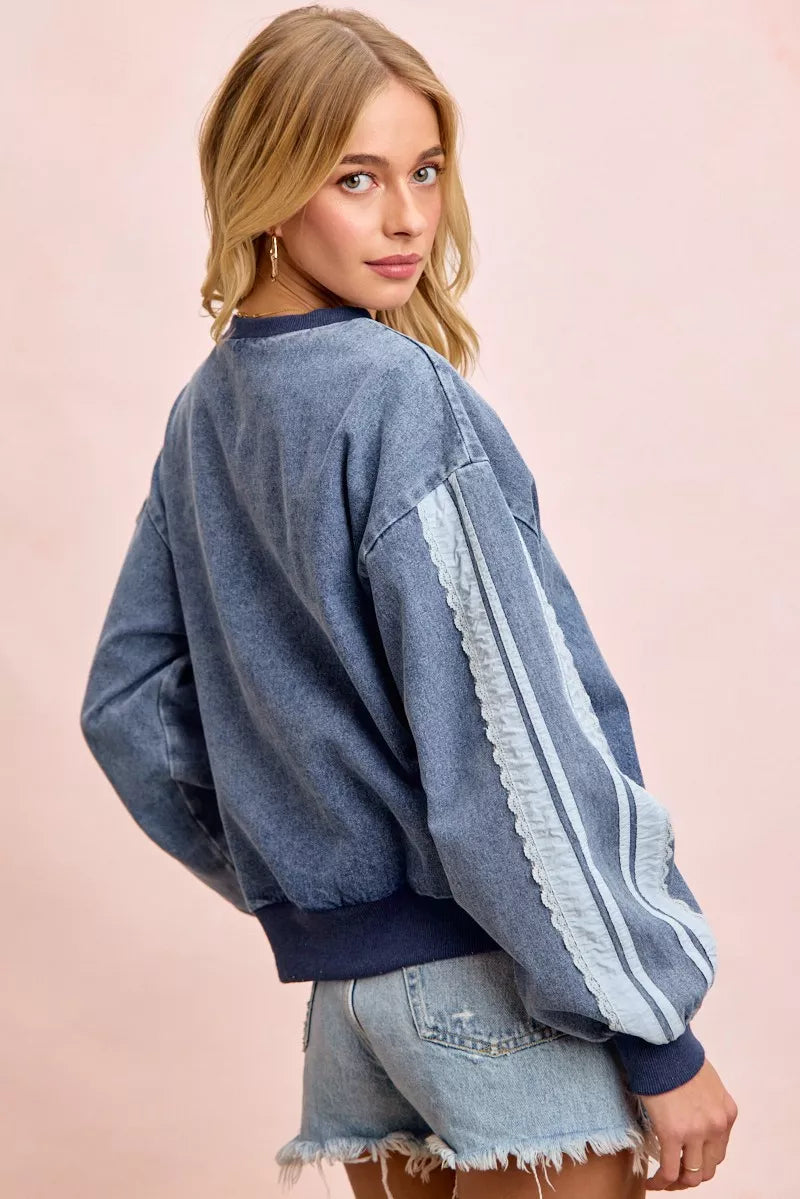 Lace side denim sweatshirt on model posing