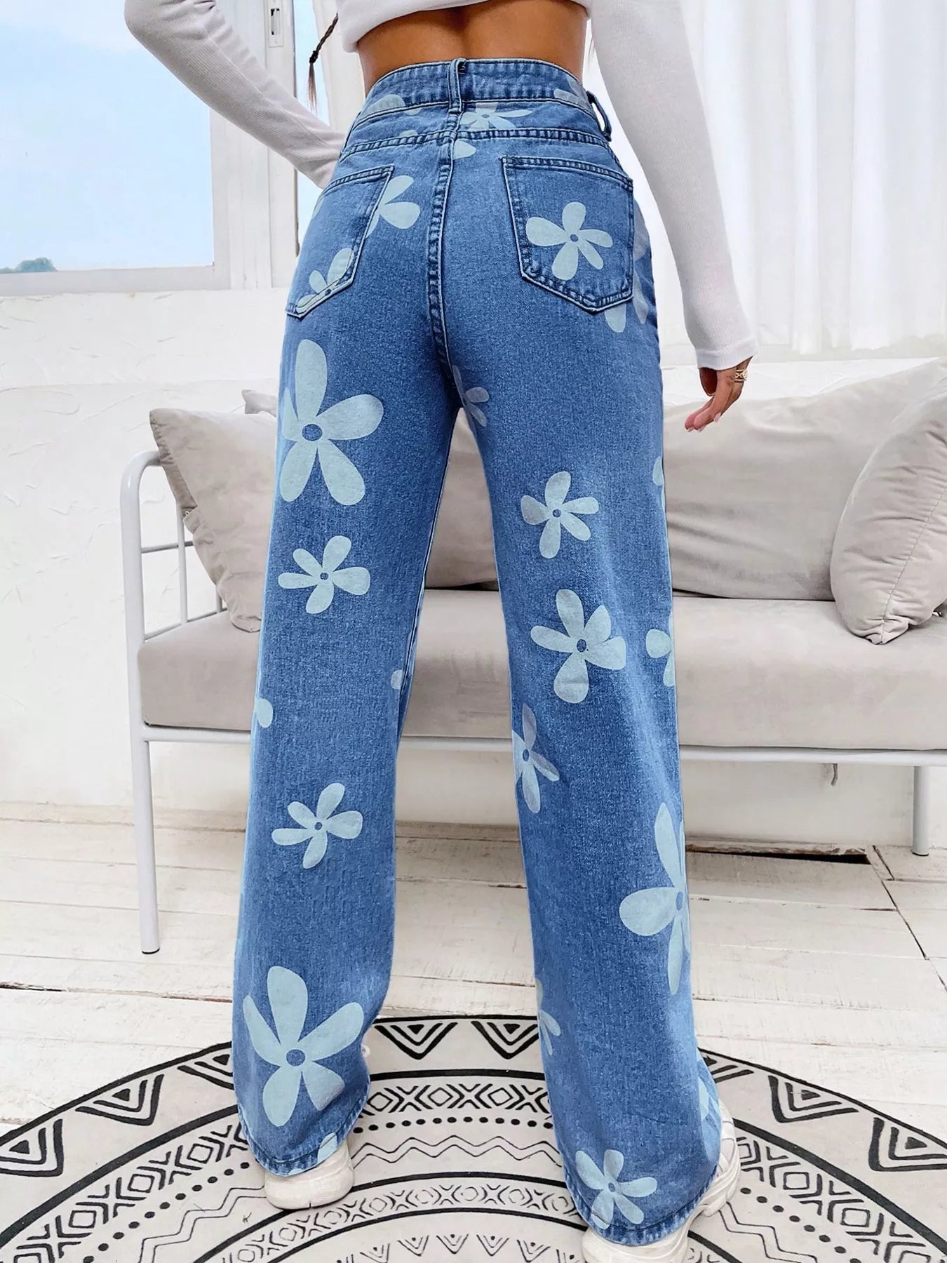 Light blue floral jeans side view with long wide leg line