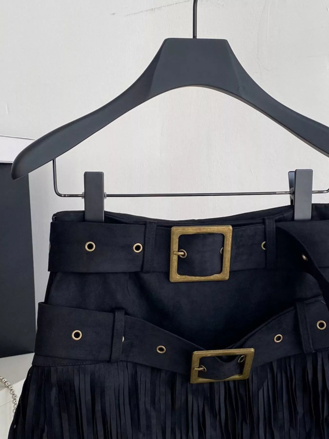 Fringe mini skirt waist and belt detail