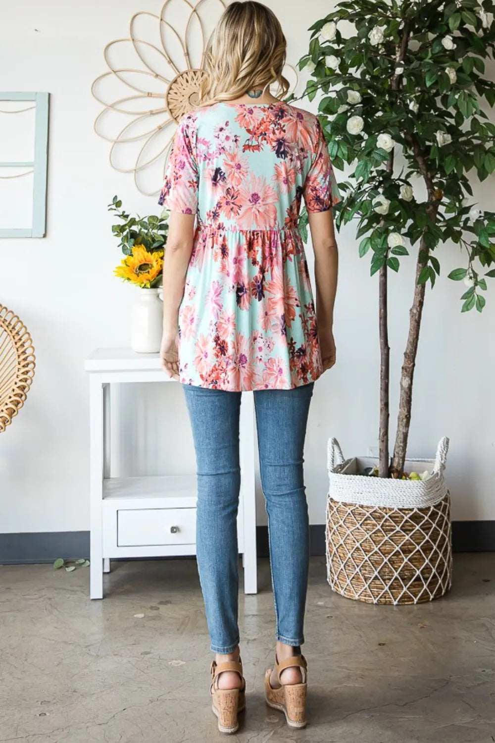 Mint floral short sleeve babydoll blouse detail of flowy hem