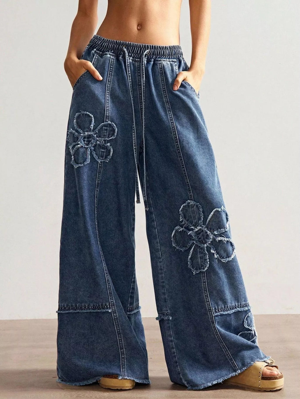 Floral applique jeans back view