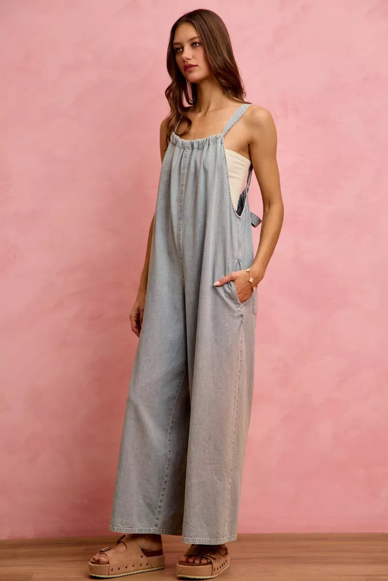 Model wearing lightweight denim overalls in a casual look