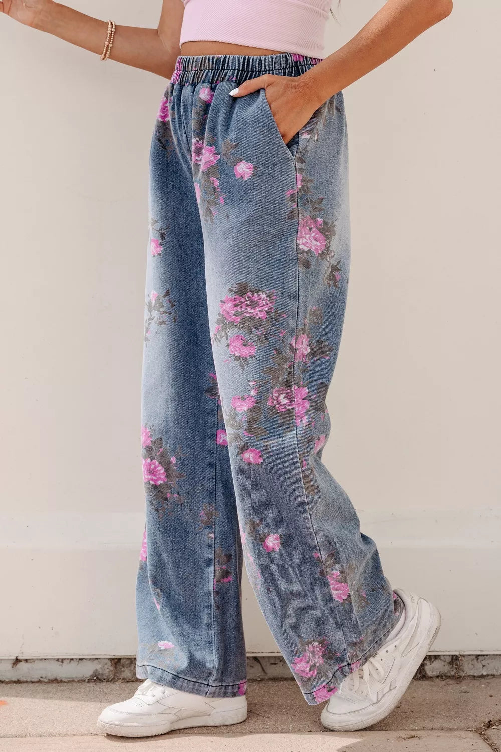 Close up of floral print on medium wash denim