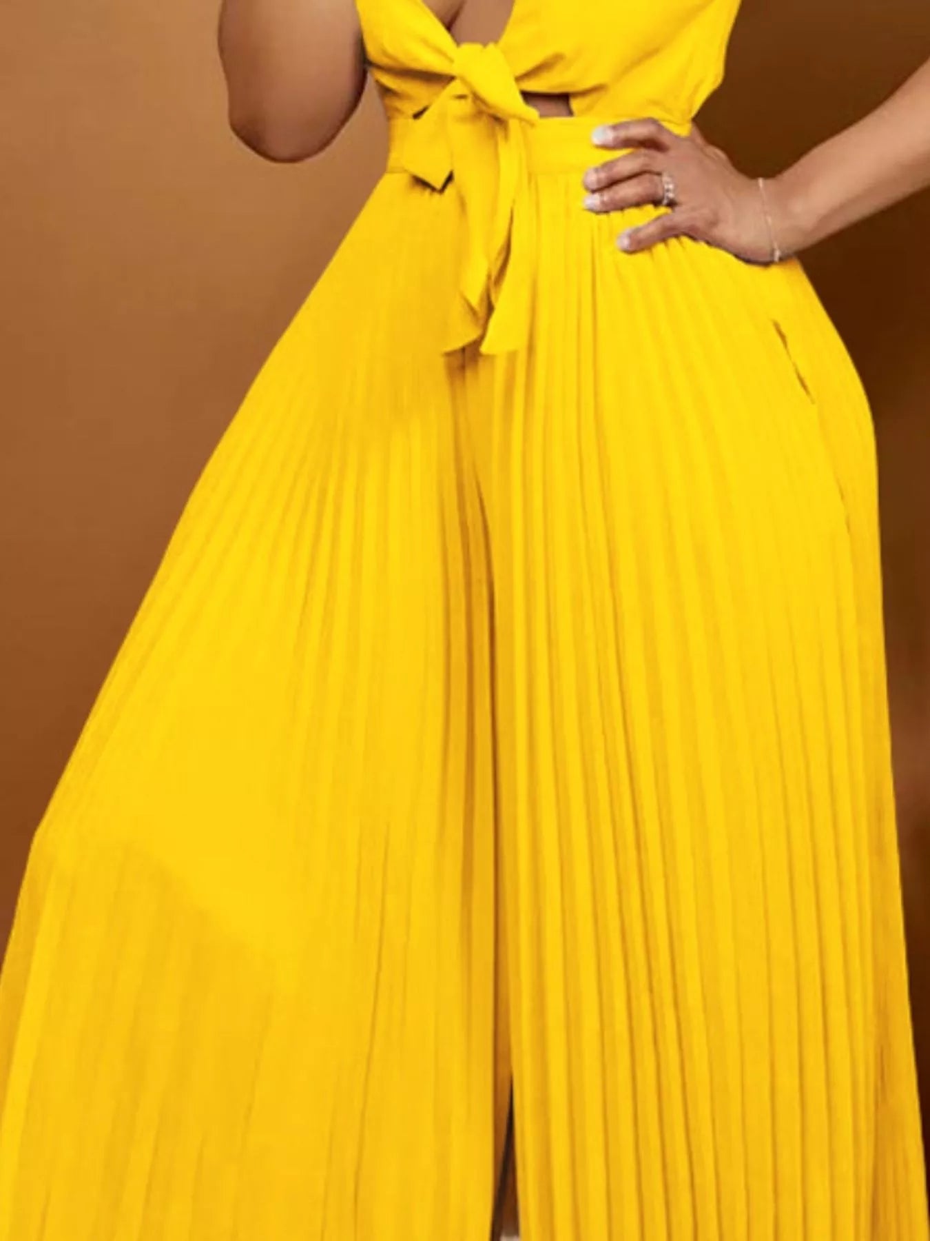 Close up of tie front waist detail on jumpsuit