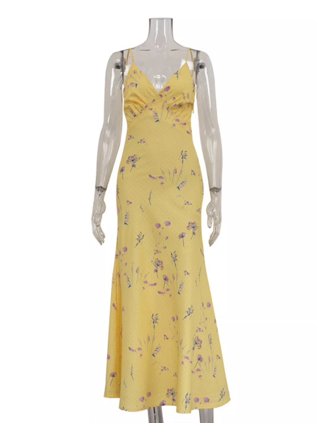 Model wearing yellow floral spaghetti strap maxi dress