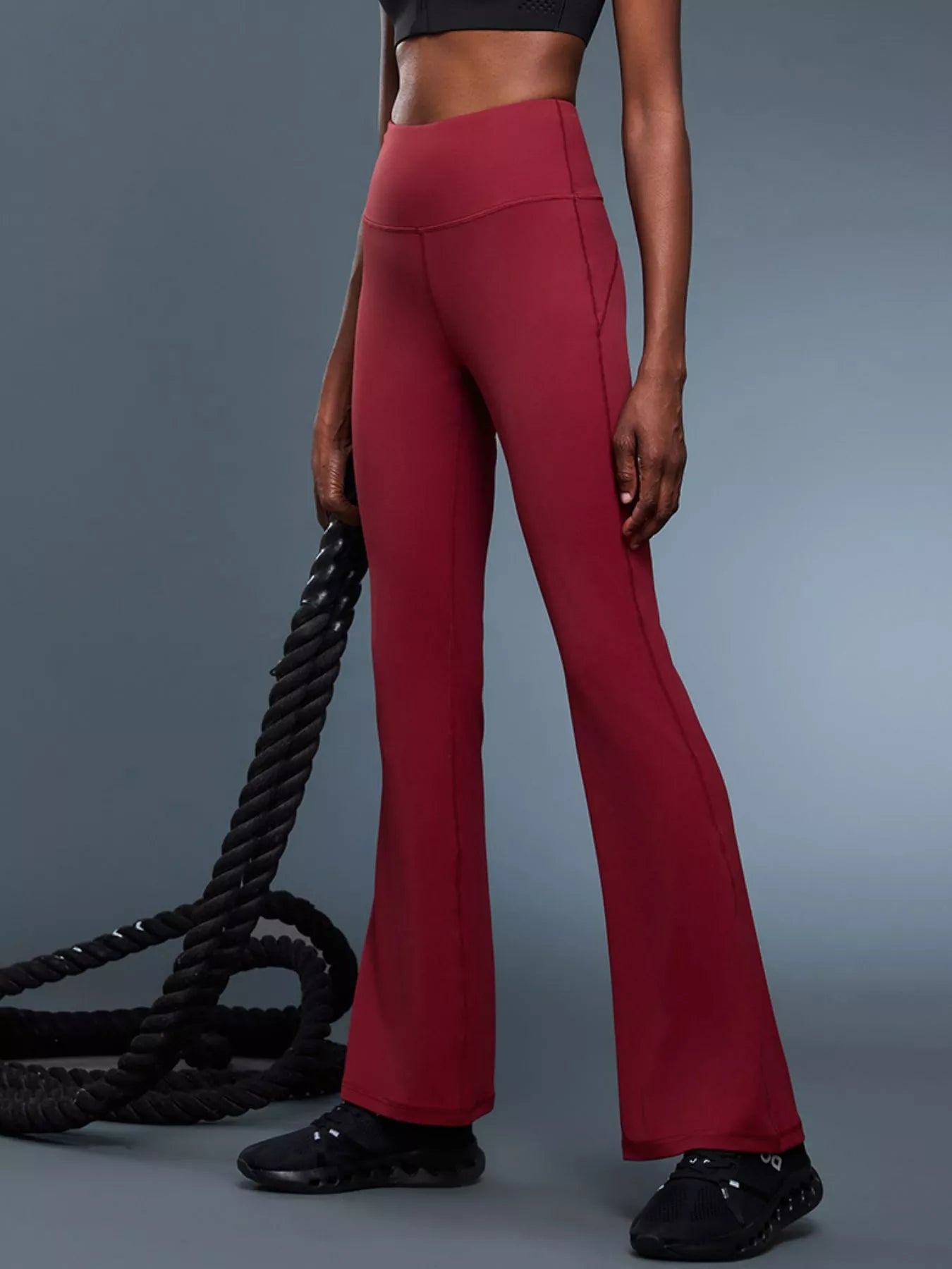 Flare active pants side view showing bootcut hem