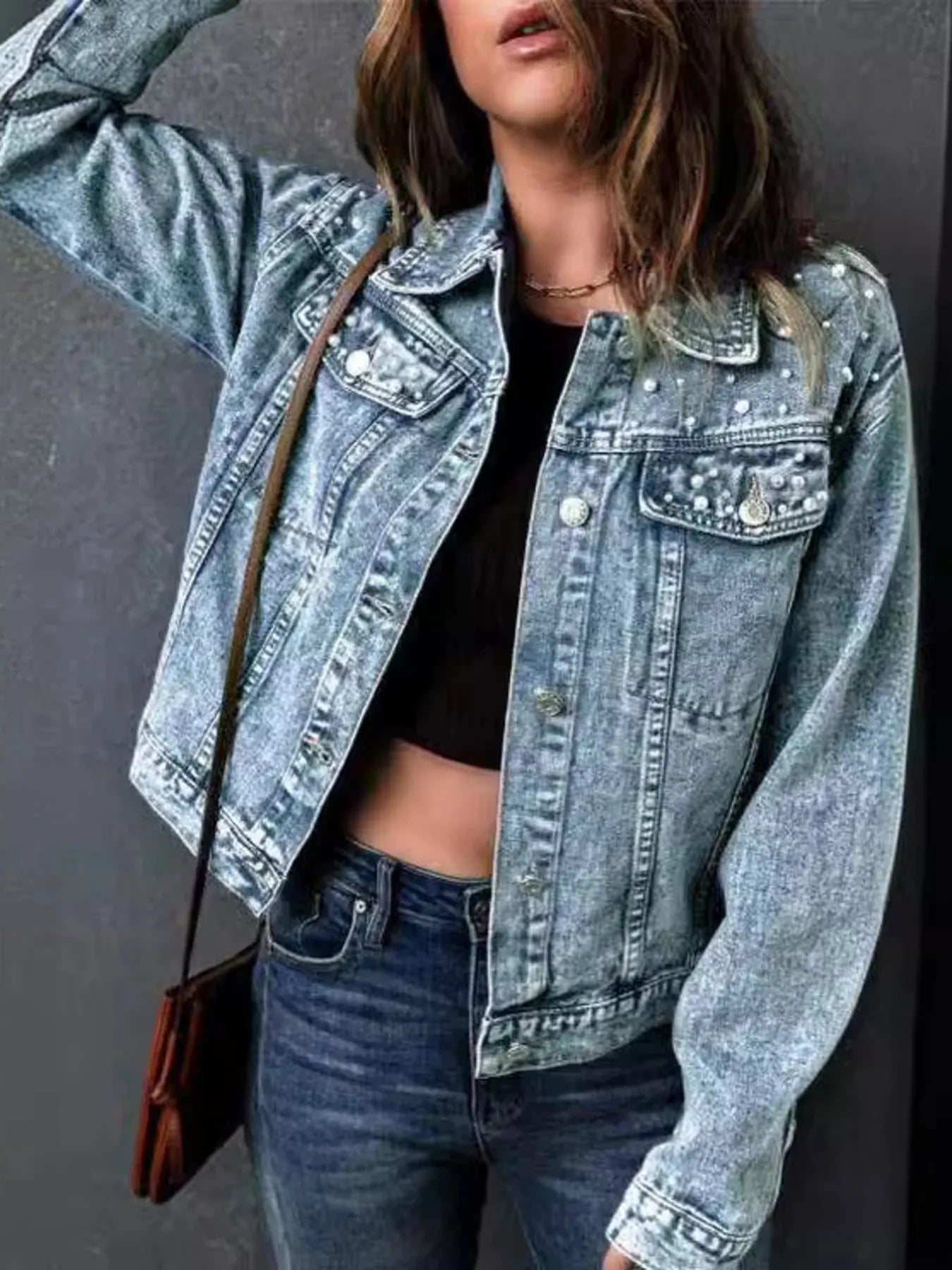 Model wearing plus size pearl detail denim jacket styled with jeans