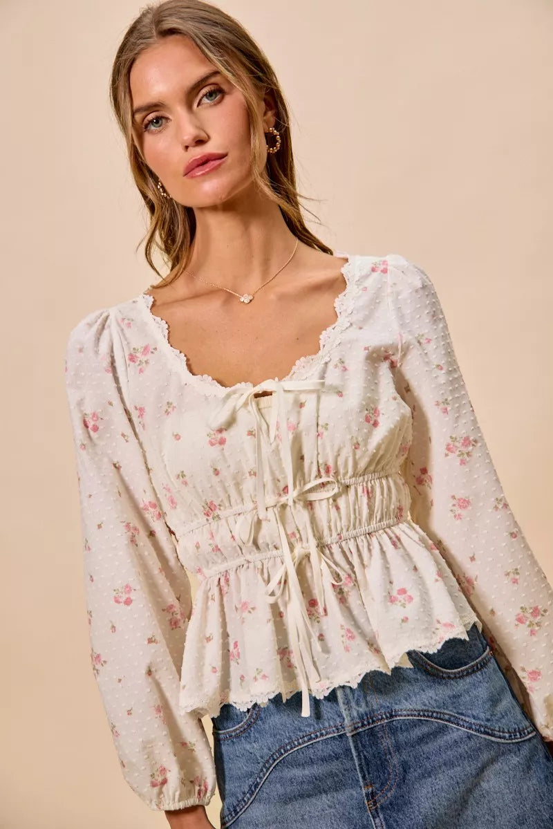 Lace trim blouse styled with jeans on model