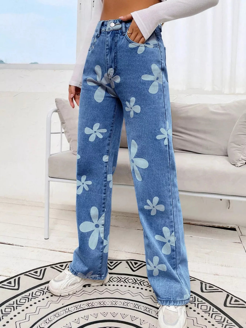 Floral detail close up on light blue denim