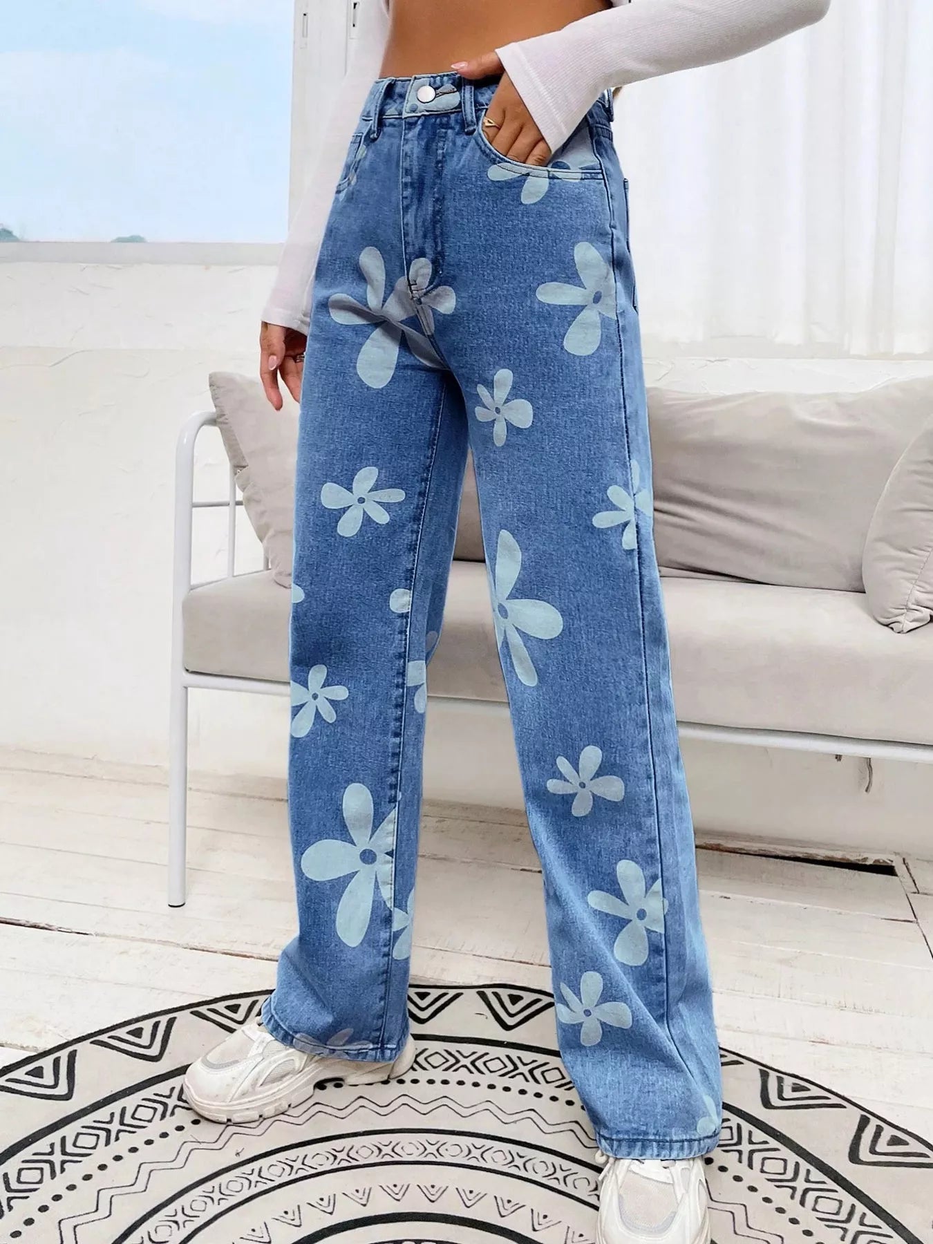 Floral detail close up on light blue denim