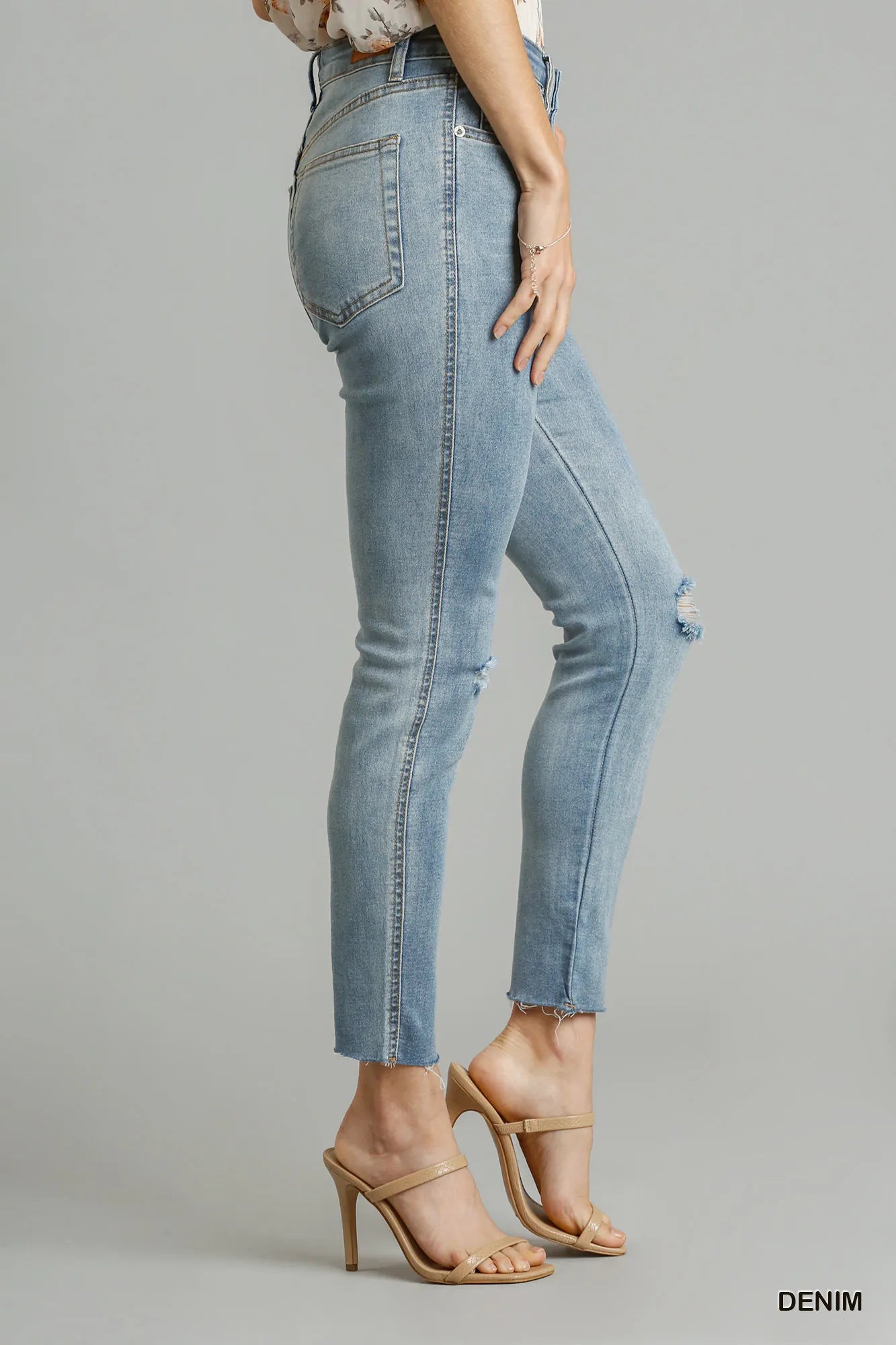 Distressed skinny jeans raw unfinished hem detail