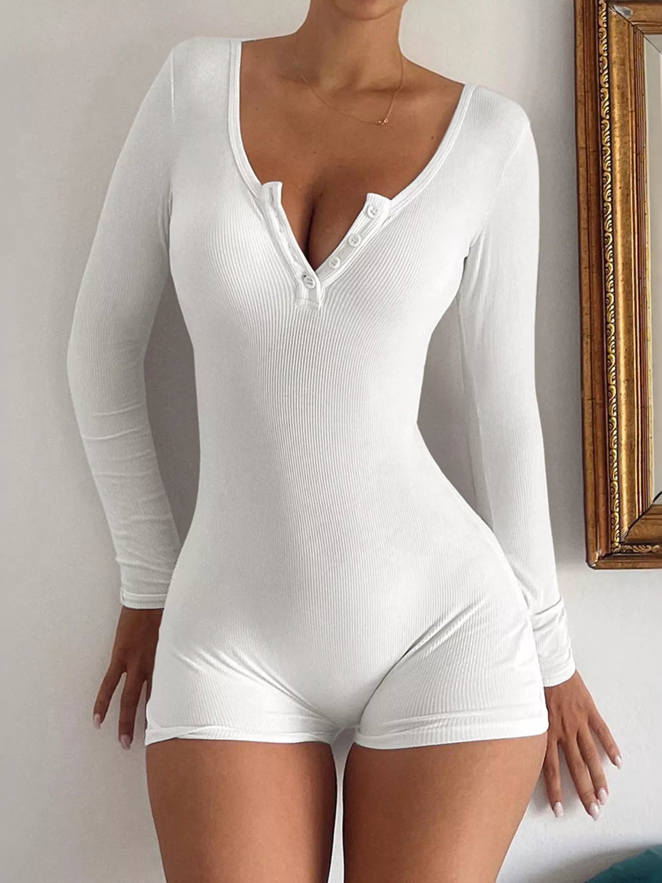 Long sleeve knit romper angled view on model