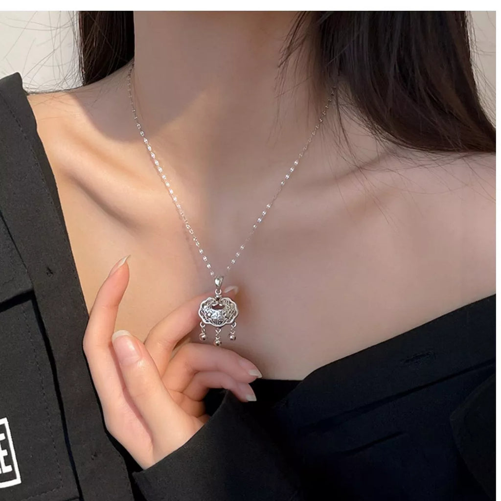 Dainty silver lock necklace angled view