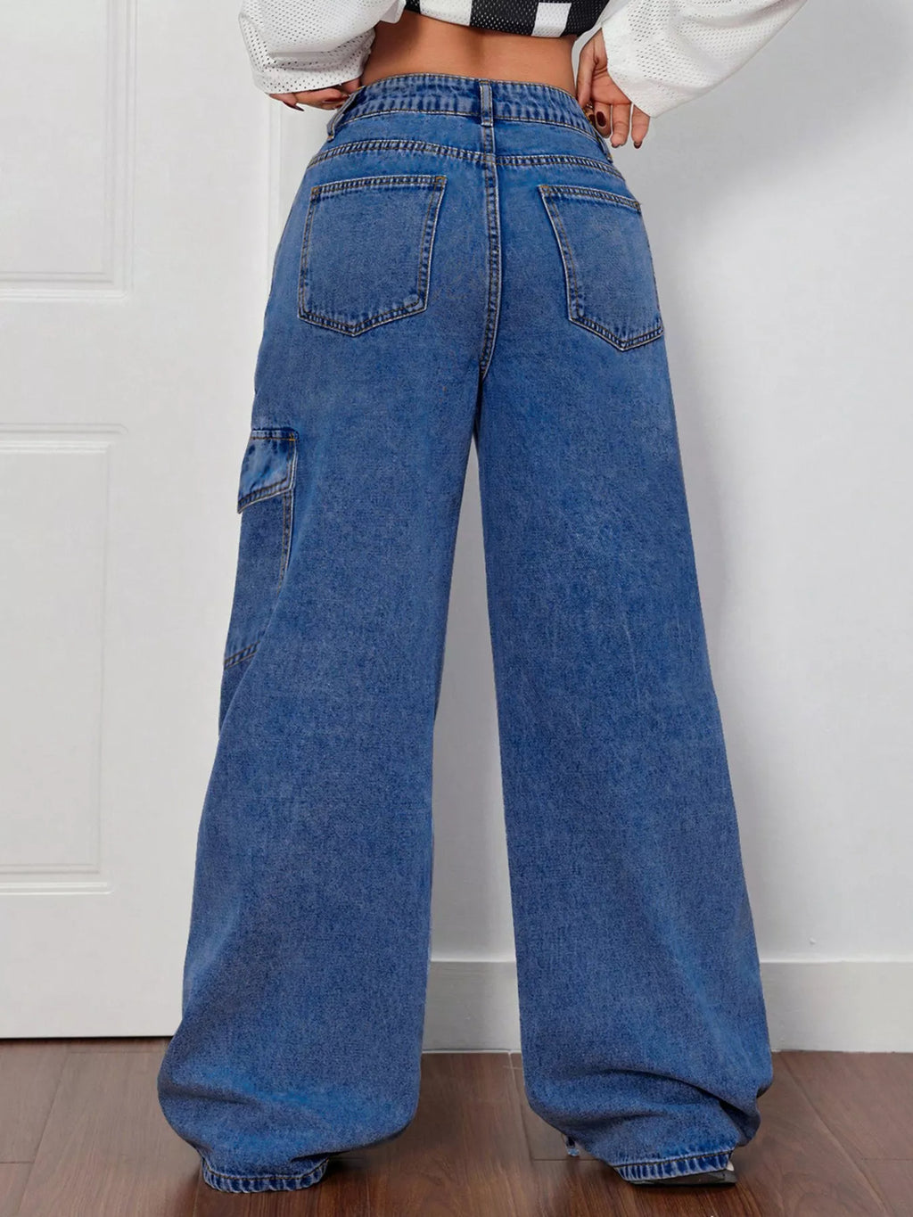 Woman wearing bow tie accent wide leg jeans