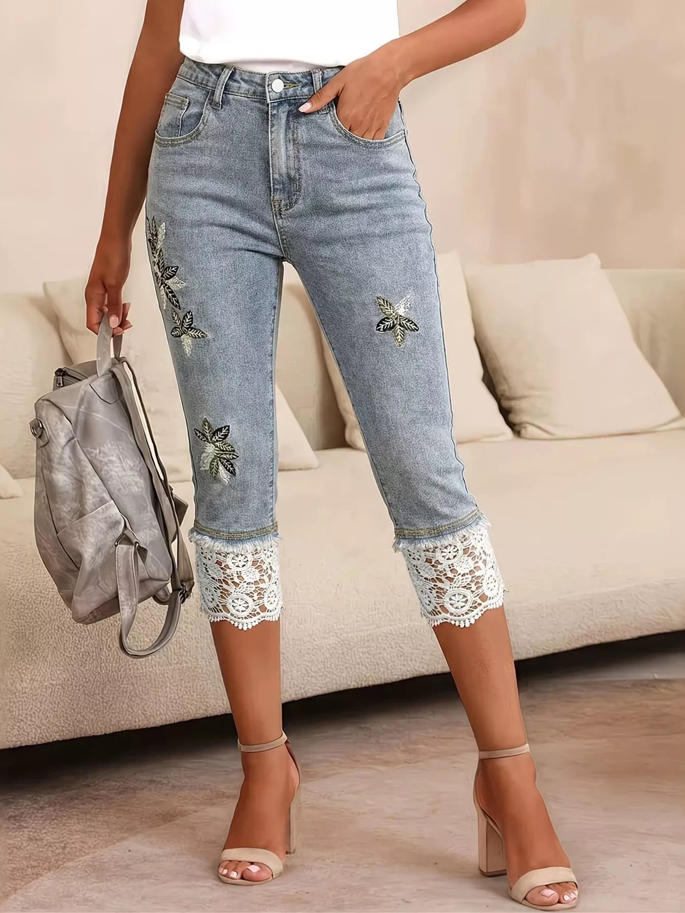 Blue lace trimmed capri jeans front view on model