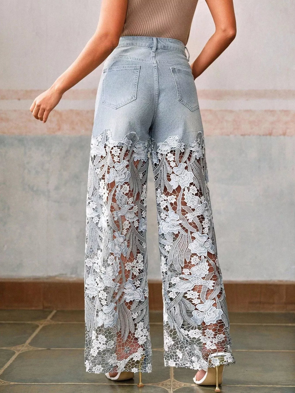 Woman wearing lace detail wide leg jeans