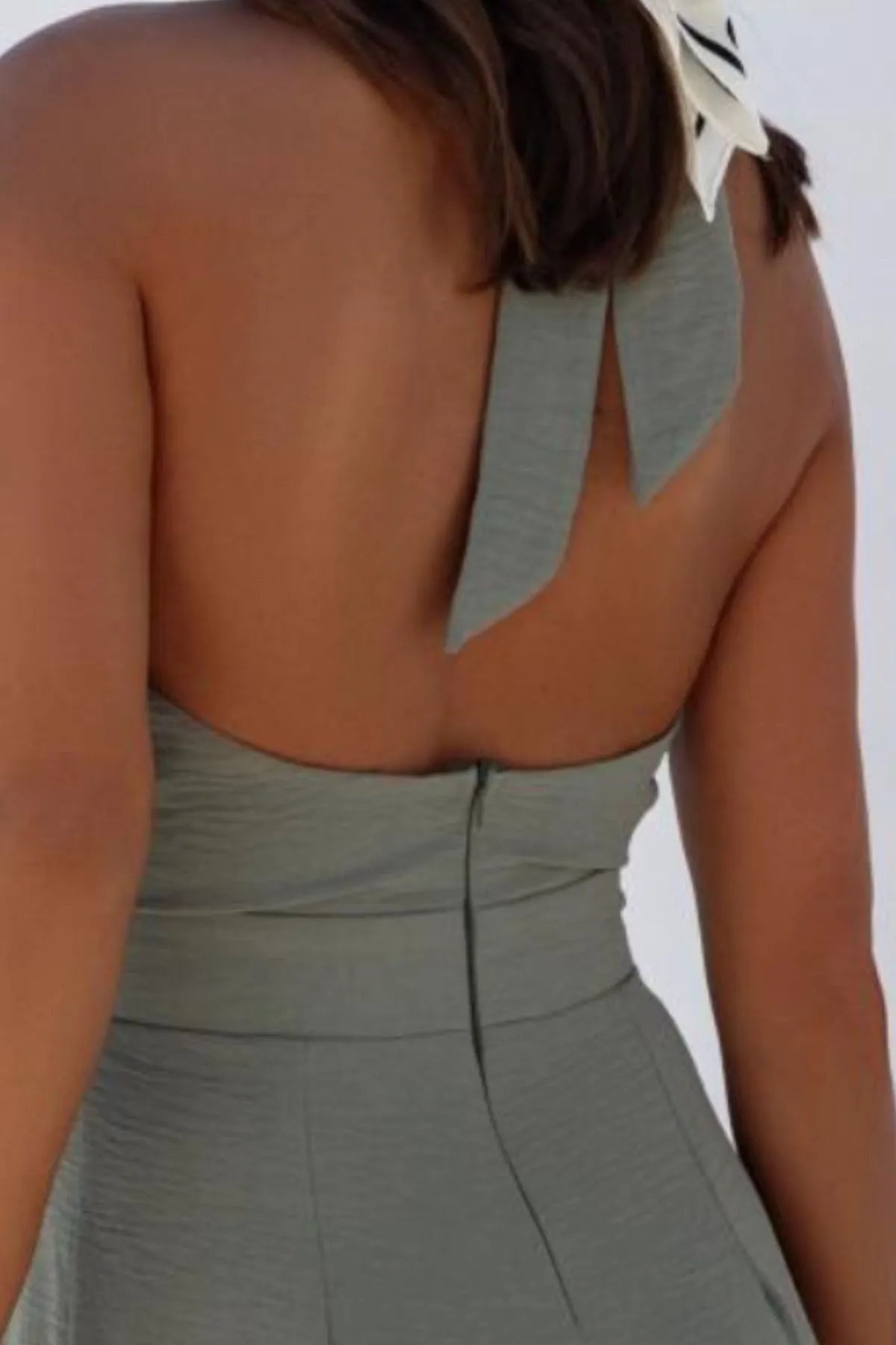 Deep purple halter neck wide leg jumpsuit front view