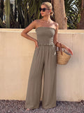 Brown smocked strapless wide leg jumpsuit front view