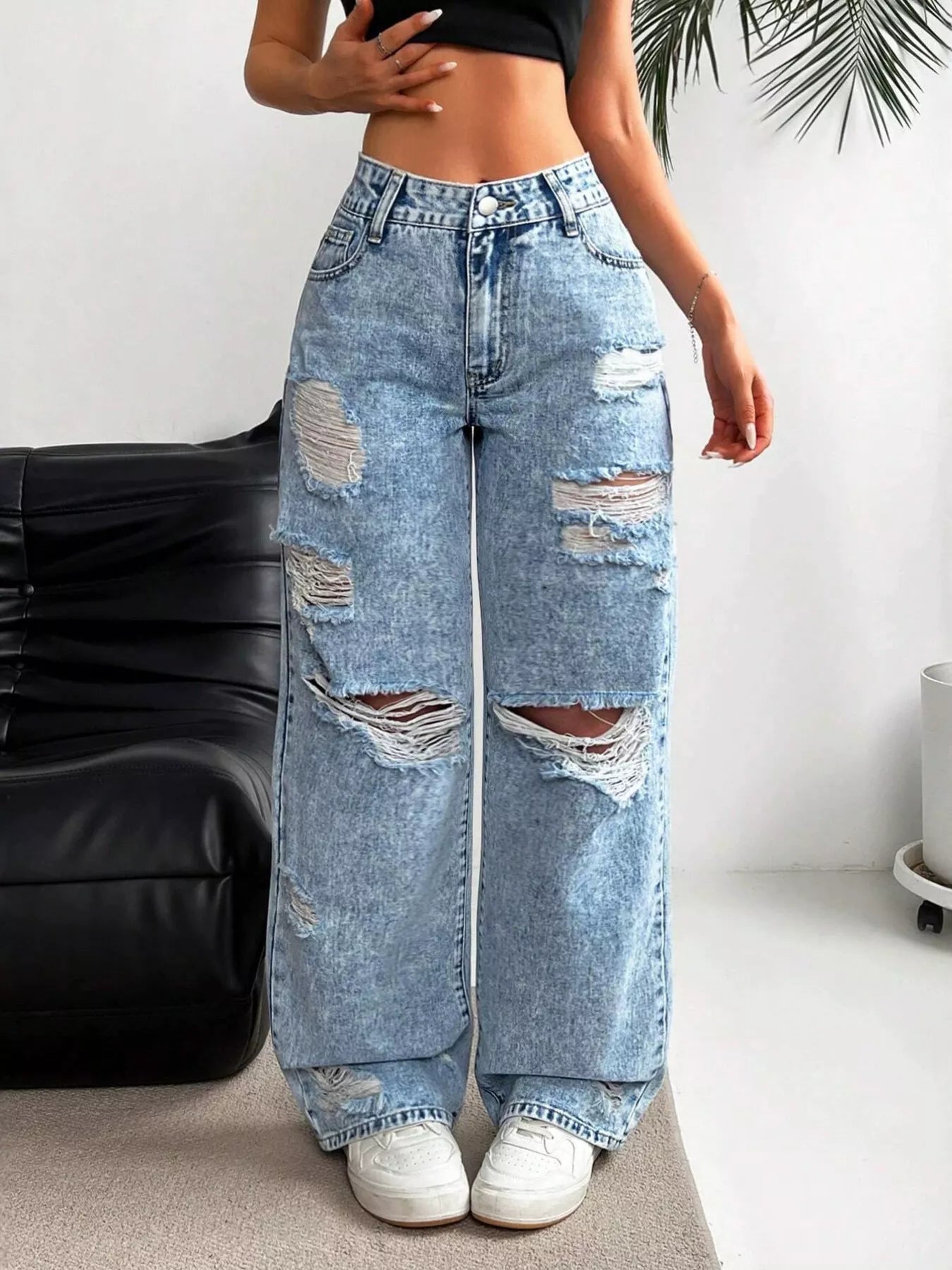 Distressed wide leg jeans in light wash front view