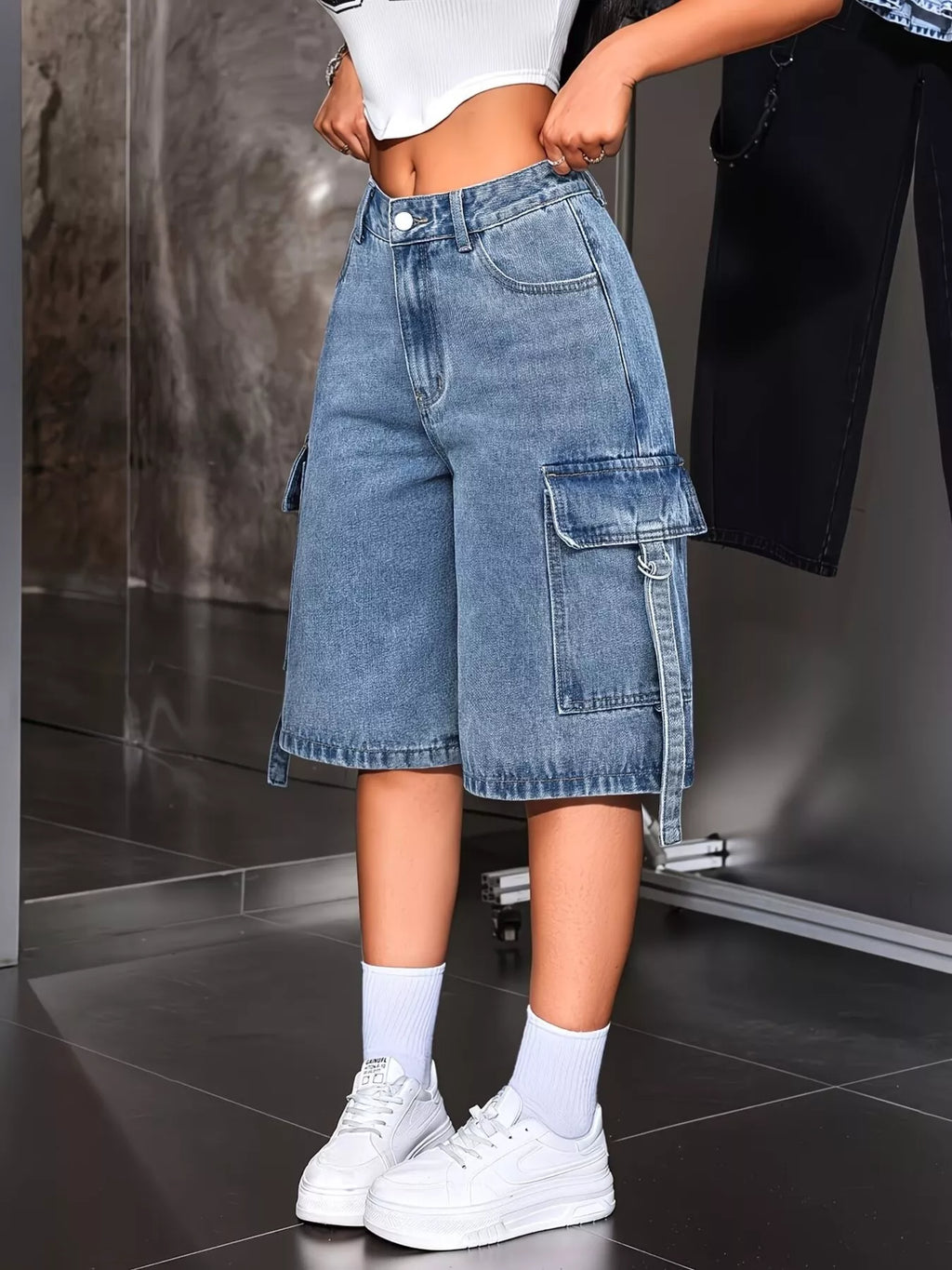 Side view of loose fit blue denim capris