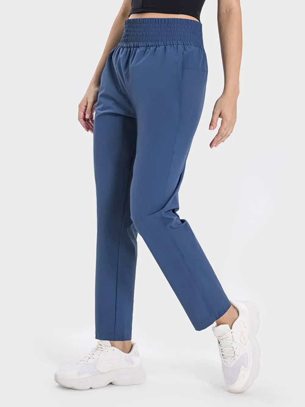 Peacock blue active pants back view on model