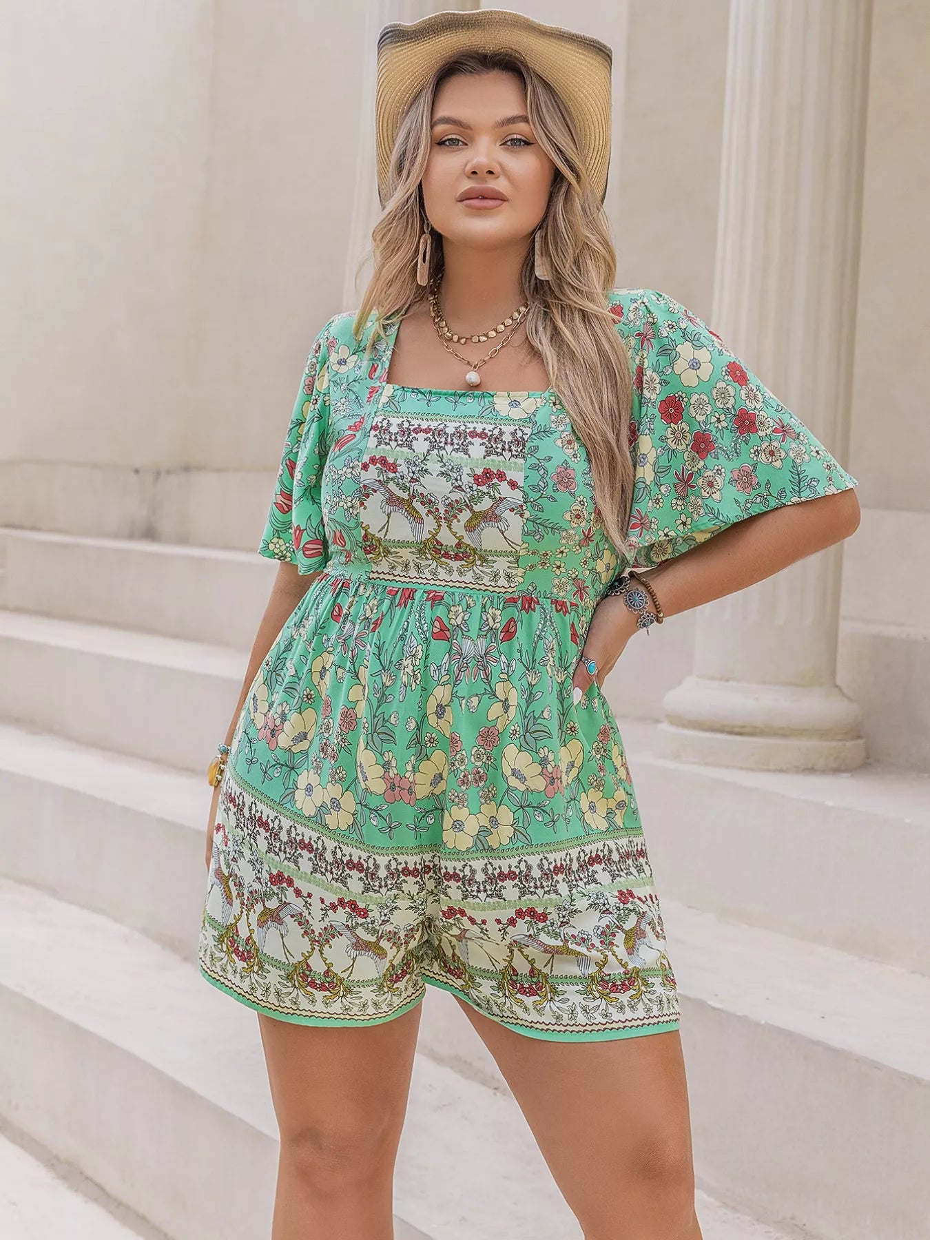 Light green floral romper back view